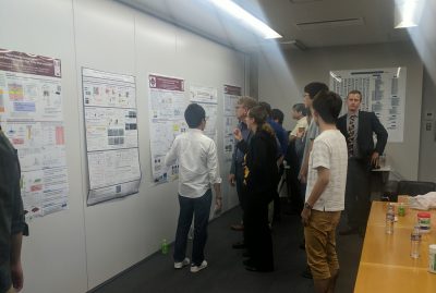 A poster session with many students